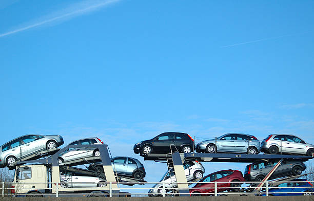 Car conveyer againgst blue sky on flyover.transport lightbox