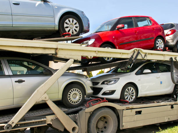 truck carying cars